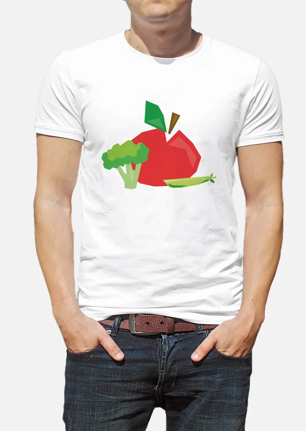 En person i vit t-shirt med ett tecknat äpple och en broccoli på bröstet