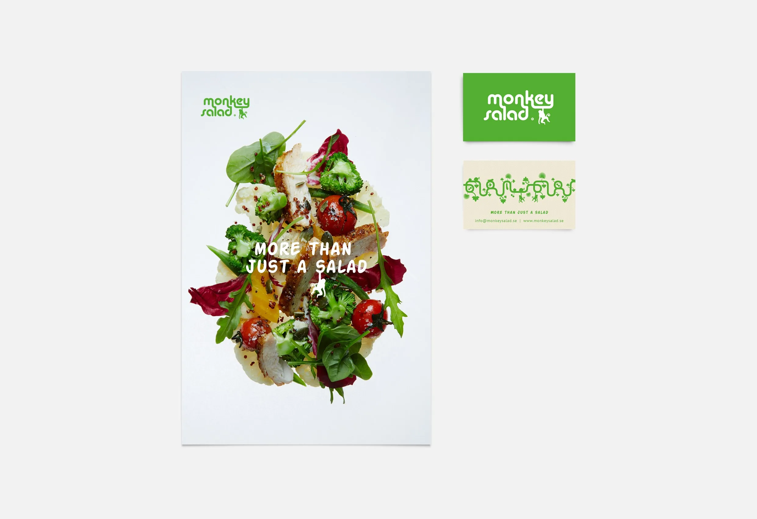 En affisch med en sallad och texten ”More than just a salad”, bredvid två visitkort i grönt